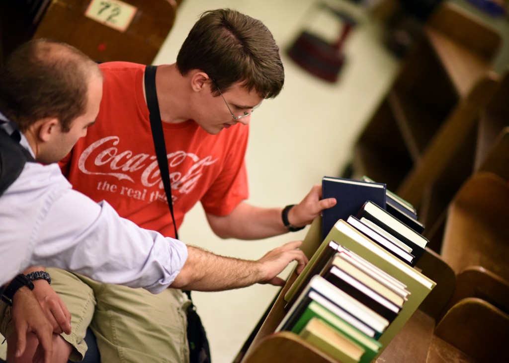 PATHSS Program participant reshelving books with their job coach